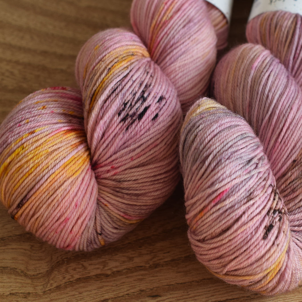 Black Elephant brand hand dyed sock yarn, pale pink with speckles