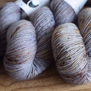 Black Elephant brand hand dyed sock yarn, greys and speckles