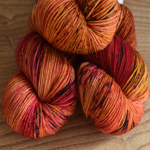 Black Elephant brand hand dyed sock yarn, deep pink and orange