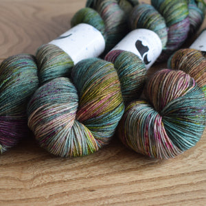 Black Elephant brand hand dyed sock yarn, turquoise, pink and green
