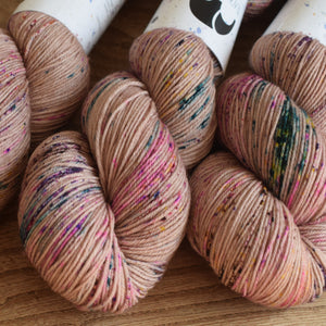 Black Elephant brand hand dyed sock yarn, pale pink with speckles