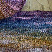 Load image into Gallery viewer, Sirdar Jewelspun aran crochet cushion kit - purple / blue / earth tones